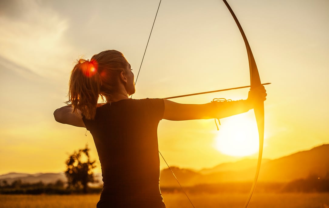 Woman Aiming In Archery